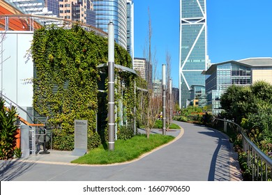 San Francisco, CA/USA 2/1/20 Rooftop garden and path at the Salesforce Transit Center with vine covered walls and unique light poles. Angular highrise beyond houses Facebook/Instagram offices.