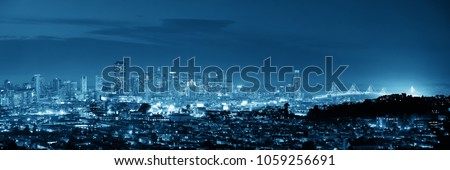 San Francisco city skyline panorama with urban architectures at night.