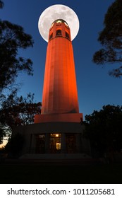 San Francisco Coit Tower in Orange Color and Super Full Moon.
