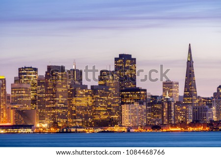 San Francisco downtown skyline at dusk from Treasure Island, California, sunset, USA.