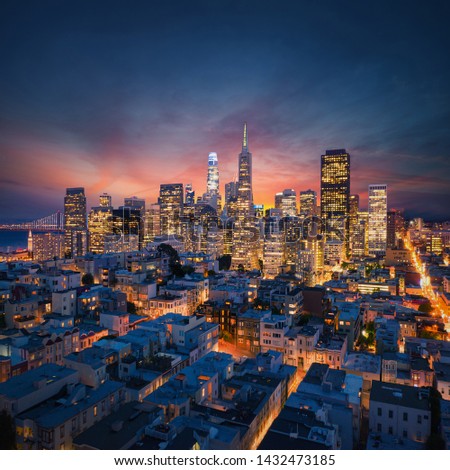 San Francisco Downtown at sunrise. California famous city at sunrise. Bay Bridge and Port of San Francisco in background
