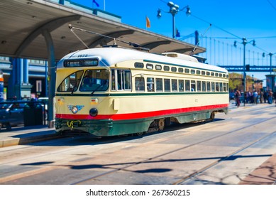 San Francisco f- streetcar, tram or muni cable trolley car traveling down the Embarcadero on a sunny day.  Vintage streetcar originally a Mexico City car built in 1946 trolley.  Tribute livery.