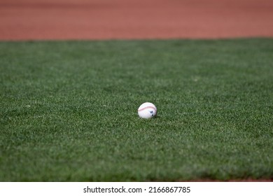 San Francisco - June 8, 2022: A ball sits on the infield during batting practice before a game between the Colorado Rockies and San Francisco Giants at Oracle Park. 