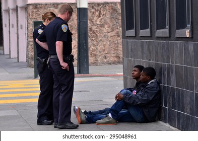 SAN FRANCISCO - MAY 15 2015:SFPD officers interrogating black american men in San Francisco.Overall, Black Americans are arrested at 2.6 times the per-capita rate of all other Americans.