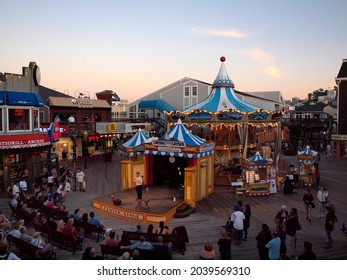 San Francisco -  September 28, 2011:  Man Performs Magic Show On Center Stage As Crowd Watches In Pier 39 Fisherman Wharf.