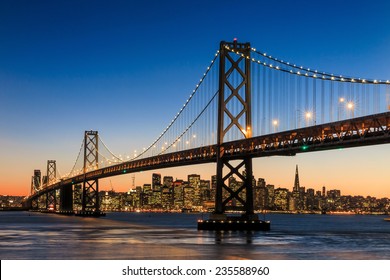 San Francisco Skyline And Bay Bridge At Sunset, California USA