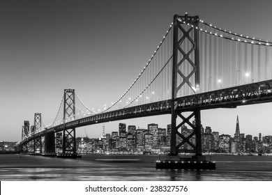 San Francisco Skyline And Bay Bridge At Sunset In Black And White