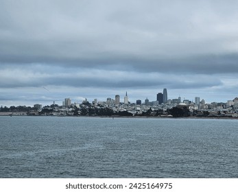 San Francisco skyline from golden gate bridge beach with a view of Alcatraz island in a cloudy day  - Powered by Shutterstock