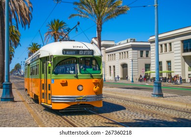 San Francisco streetcar, tram or muni trolley traveling on the Embarcadero down town on a sunny day.  Vintage streetcar originally Los Angeles built in 1946 trolley.  Tribute livery.