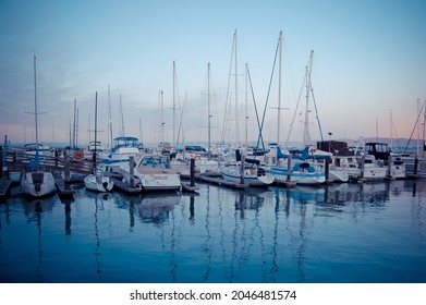 SAN FRANCISCO, UNITED STATES - Dec 19, 2011: A shot of a port with sailing boats on the seawater at sunset in San Francisco, Unites States