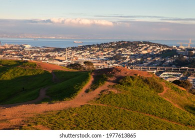 San Francisco, United States - January 25 2013: The Bernal Heights Hill Offers A Great View Of The City. Green Fields And Path Lead Up The Hill