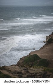 San Francisco, USA, 2019 - A Person Looking To The Ocean From The Top Of A Cliff In Mussel Rock Park, California