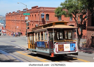 SAN FRANCISCO, USA - APRIL 8, 2014: Historic Cable Car In San Francisco, USA. Famous SF Streetcars Began Operation In 1878. Alcatraz Can Be Seen In Background.