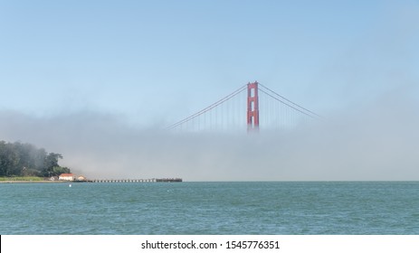 San Francisco, USA - August 2019: Golden Gate Bridge Inside Fog, Only Single Tower Visible