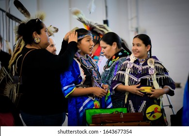 San Francisco, USA - February 08, 2020: Native American Indian Girls In Intricate Traditional Jingle Dress Preparing To Dance At A Powwow