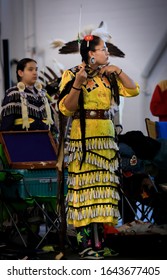 San Francisco, USA - February 08, 2020: Native American Indian Girl Dressed In Intricate Traditional Jingle Dress Preparing To Dance At A Powwow