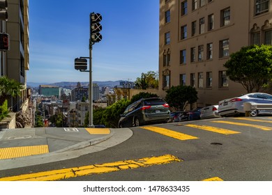 San Francisco, USA - July 18, 2019, The Yellow Crosswalk On The Road For Safety Reasons When People Cross The Street, Cars Begin To Go Down A Steep Descent. Concept, City Traffic.