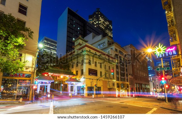 San Francisco, USA - June 12 2018: Dragon\'s\
Gate and car trail lights at night, Chinatown, San Francisco,\
California, United States of America,\
USA