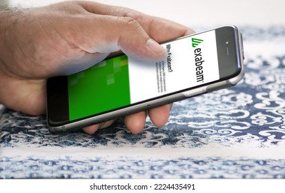 San Francisco, USA, June 2022: Hand Holding A Phone With Exabeam Mobile Application On Screen. Exabeam Is A Leading Provider Of The Software For Analyzing User And Company Behavior