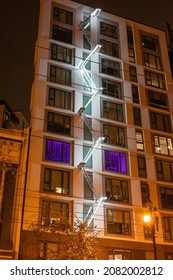 SAN FRANCISCO, USA - OCTOBER 29, 2021: Fire Escape With White Lights On Tall Building At Night In San Francisco During Autumn 2021