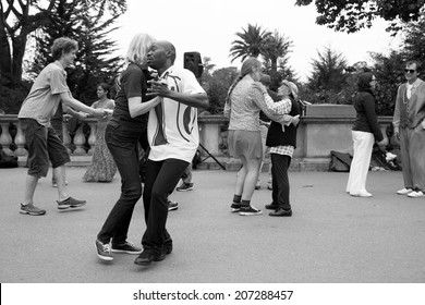 SAN FRANCISCO-JULY 13, 2014: Swing dancing in Golden Gate Park, a weekly Sunday tradition that includes a lesson.The popular free event attracts people of all ages.