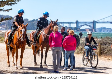 SAN FRANCISCO-SEPT 25: US Park Police Officers Greet Visitors On Sept. 25, 2013 In San Francisco. The Federal Horse-mounted Patrol Operates Only In Parks In Washington DC, New York And San Francisco.