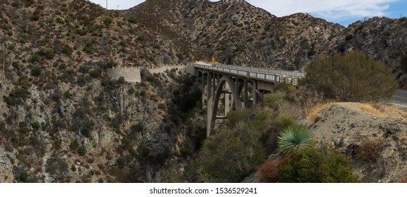 SAN GABRIEL MOUNTAINS CA/USA - OCTOBER 19, 2019: panoramic image showing the Big Tujunga Canyon bridge, Bridge to Nowhere, along the Angeles Forest Highway. 