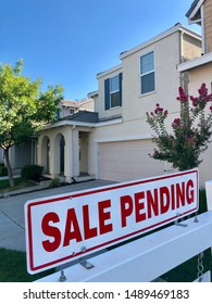 San Jose, CA - August 25, 2019: Sale Pending Sign On A White Post By A House.