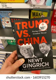 San Jose, CA - December 28, 2019: Man Holding A Book By Newt Gingrich Titled “Trump Vs. China”. #1 New York Times Bestselling Author.