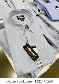 San Jose, CA - January 17, 2020: Bunch Of Button Down Mens Dress Shirts With Kirkland Signature Tags Seen Inside Costco Warehouse. 