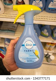 San Jose, CA - March 19, 2019: Man Holding A New Bottle Of Febreze Fabric Freshener In A Store. 