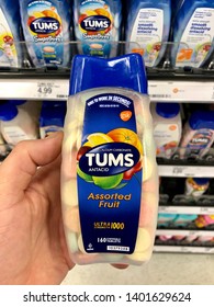 San Jose, CA - May 18, 2019: Man Holding A Bottle Of TUMS Antacid Chewable Tablets In A Store. 