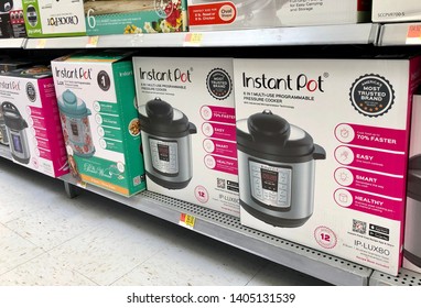 San Jose, CA - May 22, 2019: Different versions and capacity Instant Pots on a store shelf. The most popular pressure cooker on the market.