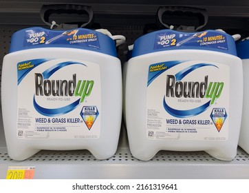 San Jose, CA - May 24, 2022: Large Spray Containers Of Round Up Weed And Grass Killer. 