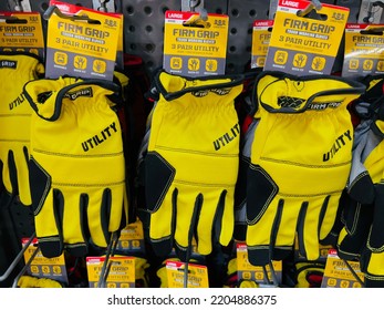 San Jose, CA - September 10, 2022: Packs Of Safety Yellow FirmGrip Brand Utility Gloves On Display Inside Big Box Store.