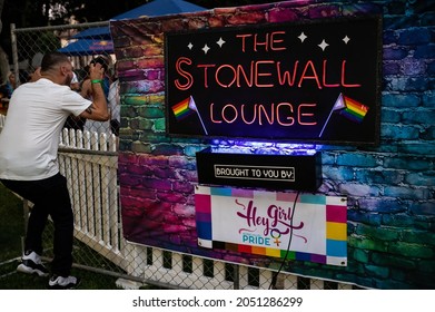 SAN JOSE, CA, U.S.A. - AUG. 28, 2021 Photo Of A Man Talking Through A Fence At The Silicon Valley Pride Stonewall Lounge Area At The Downtown Festival.