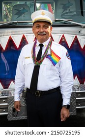 SAN JOSE, CA, U.S.A. - AUG. 29, 2021:San Jose Fire Chief Robert Sapien Jr. Poses With A Rainbow Flag In Front Of A Fire Engine During Silicon Valley Pride.. Sapien Describes Himself As An Ally.