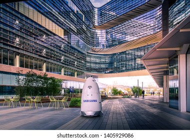 San Jose, CA/ USA - March 26, 2019:  Autonomous Security Robot Knightscope With Samsung Logo Patrols Samsung Electronics Campus Territory, Artificial Intelligence Guard Policeman  