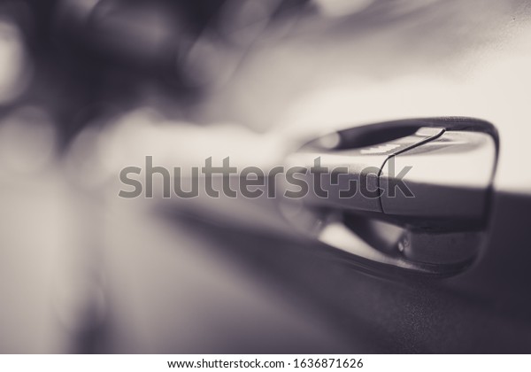 San Jose California / United States - February 1\
2020: Beautiful 2019 Ford Mustang door handle with a lot of bokeh\
in black and white