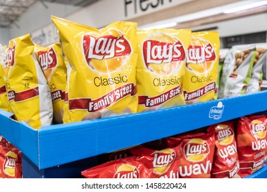 San Jose, CA/USA 07/20/2019 Plastic Bags Of Lay's Brand Potato Chips For Sale In A Supermarket Aisle