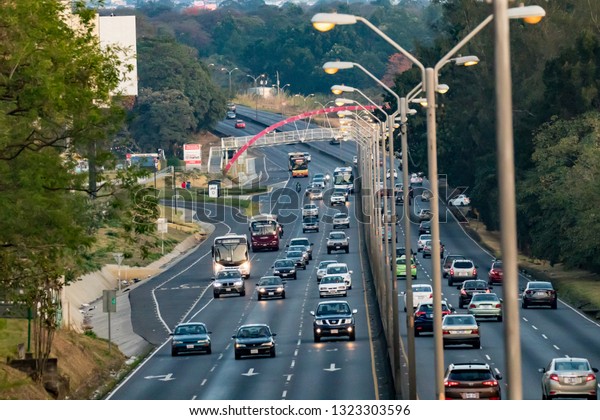 San Jose, Costa Rica -\
1/26/2019: \
 Morning traffic on a primary highwas in San Jose,\
Costa Rica