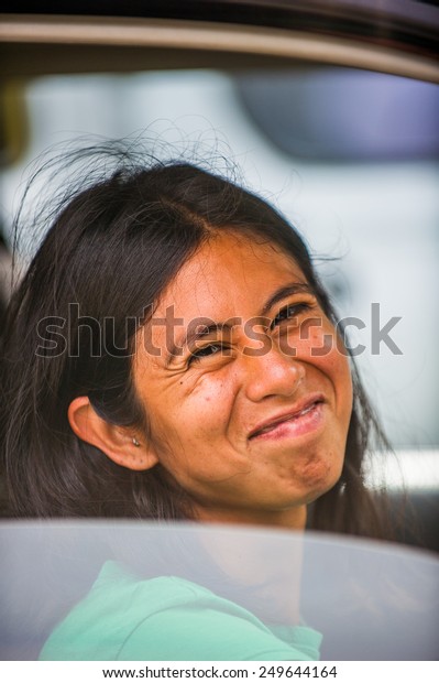 SAN JOSE, COSTA RICA - JAN 6,\
2012: Unidentified Costa Rican woman smiles out the car. 65.8% of\
Costa Rican people belong to the White (Castizo) ethnic\
group