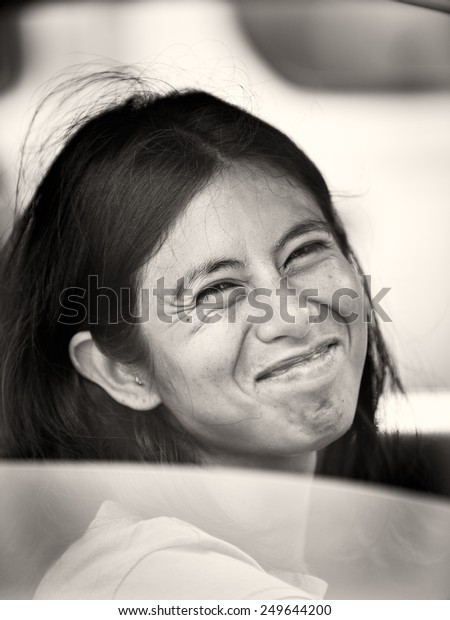SAN JOSE, COSTA RICA - JAN 6,\
2012: Unidentified Costa Rican woman smiles out the car. 65.8% of\
Costa Rican people belong to the White (Castizo) ethnic\
group