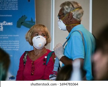 San Jose, Costa Rica March 22, 2020: Old Couple With Mask At The Airport In Costa Rica Traveling Back To The United States, High Risk