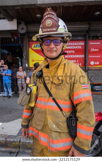 San Jose, Costa Rica - September 16,\
2022: Fire chief on a busy avenue in the city\
center