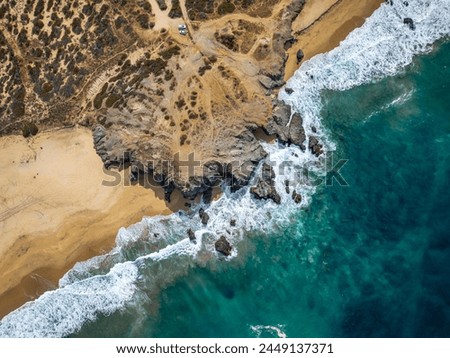 Similar – Aerial Drone View Of Dramatic Ocean Waves Crushing On Rocky Landscape