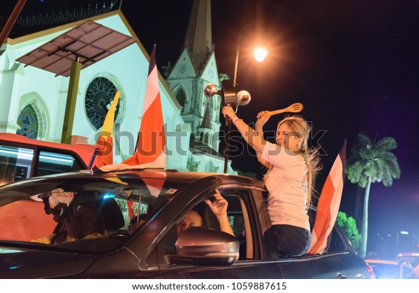 San Jose/Costa Rica - April 1, 2018: People\
celebrating in San Jose downtown cheering for the PAC party that\
won the elections in 2018