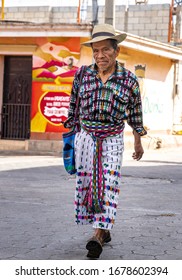 San Juan, Lake Atitlan, Guatemala, 1st Mar 2020: Mayan man in traditional clothing walking in a street of San Juan