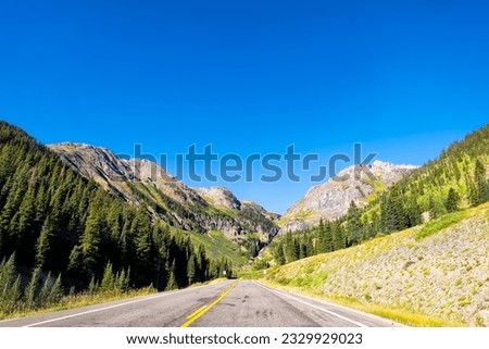 San Juan mountains on million dollar 550 highway from Durango to Silverton, Aspen Colorado in 2019 summer morning at sunrise with paved empty road
