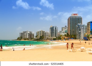 SAN JUAN, PUERTO RICO - JUNE 11, 2014: People Relaxing At Popular Touristic Condado Beach In San Juan, Puerto Rico, On June 11, 2014